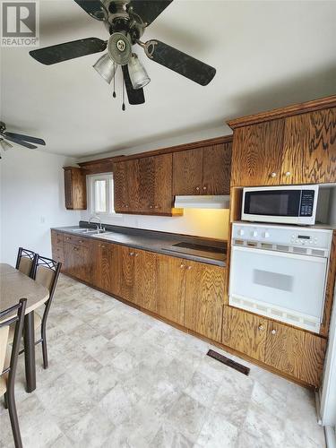 211 Main Street, Peterview, NL - Indoor Photo Showing Kitchen With Double Sink