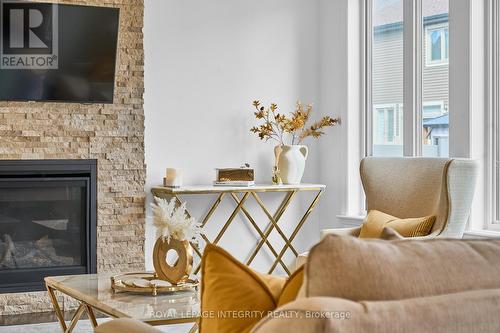 32 Aconitum Way, Ottawa, ON - Indoor Photo Showing Living Room With Fireplace