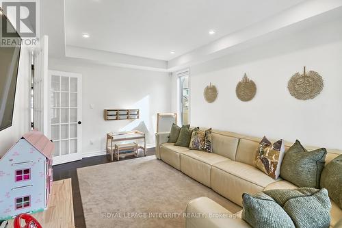 Living room with French door - 32 Aconitum Way, Ottawa, ON - Indoor Photo Showing Living Room