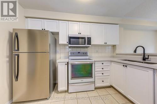 102 - 5260 Mcfarren Boulevard, Mississauga, ON - Indoor Photo Showing Kitchen With Double Sink