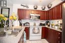 714 - 1600 Charles Street, Whitby (Port Whitby), ON  - Indoor Photo Showing Kitchen With Double Sink 