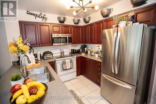 714 - 1600 Charles Street, Whitby (Port Whitby), ON - Indoor Photo Showing Kitchen With Double Sink