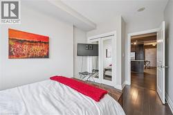 Dining area featuring ornamental molding and dark wood-type flooring - 