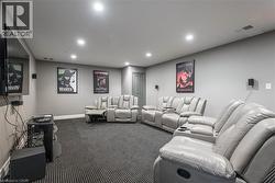 Carpeted cinema featuring recessed lighting and baseboards - 