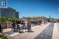 View of patio with an outdoor fire pit - 