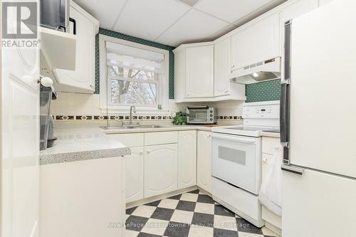 10 - 2405 Lakeshore Road, Burlington (Brant), ON - Indoor Photo Showing Kitchen With Double Sink