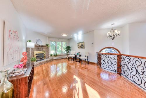 Living room - 40 Rue Courval, Kirkland, QC - Indoor Photo Showing Other Room With Fireplace