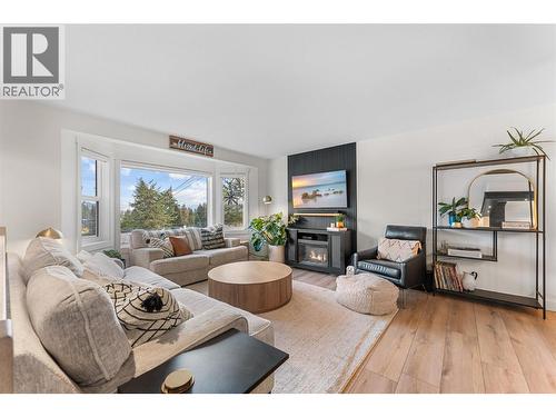 Gorgeous modern updates throughout! - 3380 Mciver Road, West Kelowna, BC - Indoor Photo Showing Living Room With Fireplace