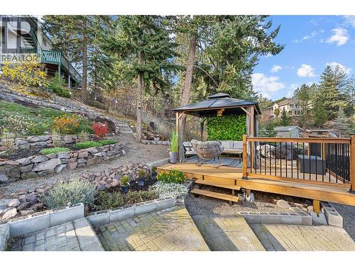 Landscaping and new detached deck help create an amazing zen retreat in your own backyard! - 3380 Mciver Road, West Kelowna, BC - Outdoor With Deck Patio Veranda