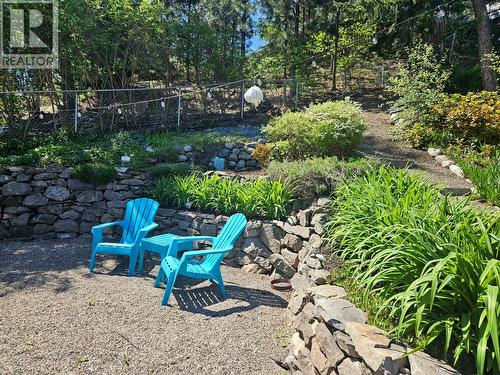 Summertime adds green and floral accents to the yard. - 3380 Mciver Road, West Kelowna, BC - Outdoor