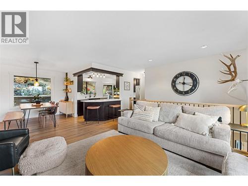Comfortable main living area flows into the kitchen. - 3380 Mciver Road, West Kelowna, BC - Indoor Photo Showing Living Room