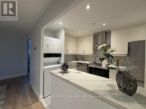 107 - 3695 Kaneff Crescent, Mississauga, ON - Indoor Photo Showing Kitchen With Double Sink