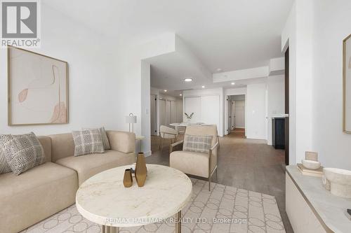 Virtually Staged - 1310 - 1050 Eastern Avenue, Toronto, ON - Indoor Photo Showing Living Room