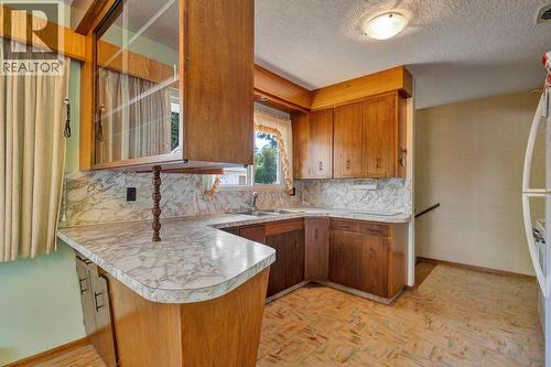 4693 Raymer Road, Kelowna, BC - Indoor Photo Showing Kitchen With Double Sink