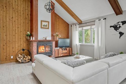 Living room - 201-111 Av. Hochar, Saint-Sauveur, QC - Indoor Photo Showing Other Room With Fireplace