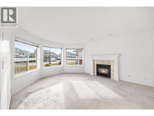 2304 Bradley Drive, Armstrong, BC - Indoor Photo Showing Living Room With Fireplace