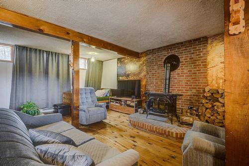 Family room - 449 Ch. Birchwood, Saint-Sauveur, QC - Indoor Photo Showing Living Room With Fireplace