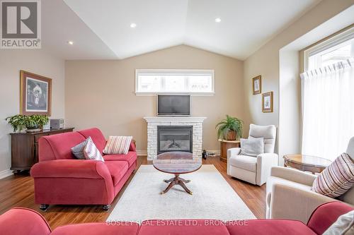 16 - 409 Niagara Street, St. Catharines (Carlton/Bunting), ON - Indoor Photo Showing Living Room With Fireplace