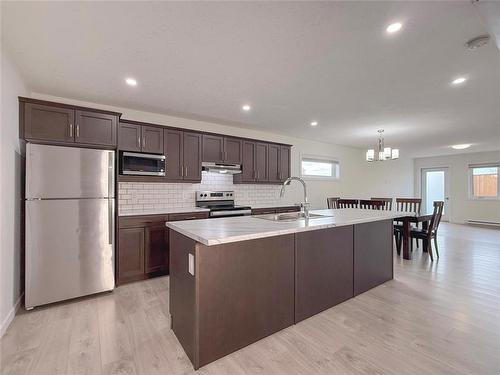 2 Dietrich Bay, Brandon, MB - Indoor Photo Showing Kitchen With Double Sink With Upgraded Kitchen