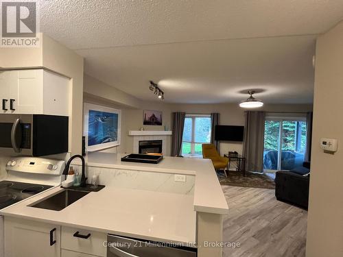 706 Johnston Park Avenue, Collingwood, ON - Indoor Photo Showing Kitchen With Fireplace