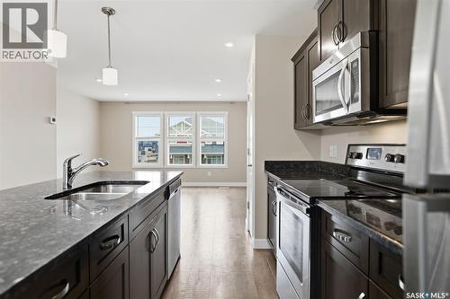 560 Pringle Crescent, Saskatoon, SK - Indoor Photo Showing Kitchen With Stainless Steel Kitchen With Double Sink With Upgraded Kitchen