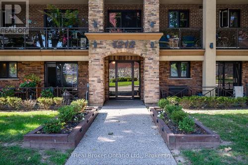 303 - 1212 Fennell Avenue E, Hamilton (Huntington), ON - Outdoor With Fireplace