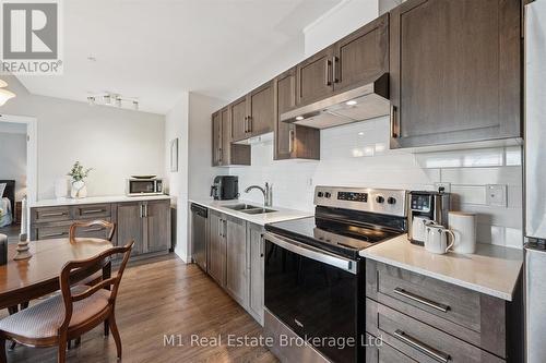 215 - 35 Kingsbury Square, Guelph (Pineridge/Westminster Woods), ON - Indoor Photo Showing Kitchen With Double Sink With Upgraded Kitchen