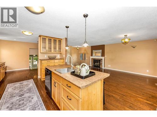 2916 Allenby Way, Vernon, BC - Indoor Photo Showing Kitchen With Fireplace