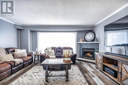 Abundance of natural light - 416 Mayfair Avenue, Oshawa (Centennial), ON - Indoor Photo Showing Living Room With Fireplace