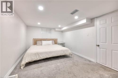 Carpeted bedroom with baseboards and recessed lighting - 50 Walnut Street, Kitchener, ON - Indoor Photo Showing Bedroom