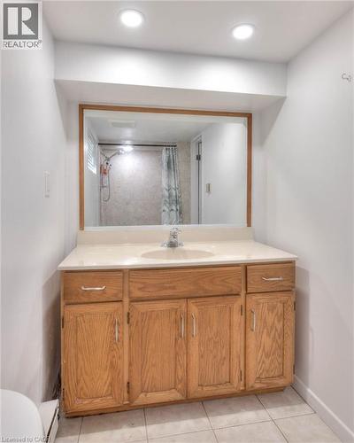 Bathroom with vanity, light tile patterned floors, a shower with curtain, and recessed lighting - 50 Walnut Street, Kitchener, ON - Indoor Photo Showing Bathroom