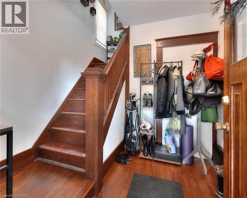 Staircase with wood finished floors and healthy amount of natural light - 50 Walnut Street, Kitchener, ON - Indoor Photo Showing Other Room