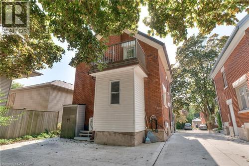 Rear view of property featuring brick siding - 50 Walnut Street, Kitchener, ON - Outdoor With Balcony With Exterior