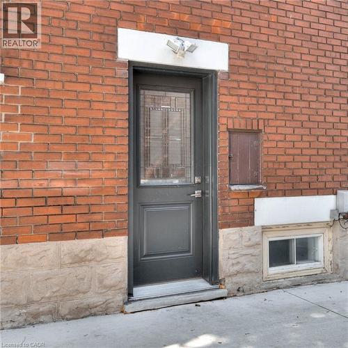 Entrance to property featuring brick siding - 50 Walnut Street, Kitchener, ON - Outdoor With Exterior