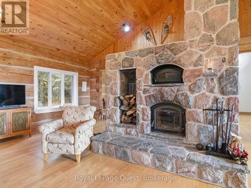 160 14 Concession W, Tiny, ON - Indoor Photo Showing Living Room With Fireplace