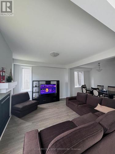 841 Cappamore Drive, Ottawa, ON - Indoor Photo Showing Living Room With Fireplace