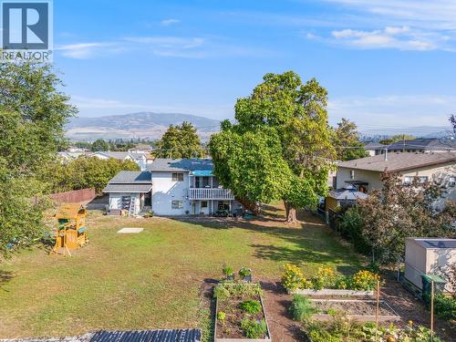 Large, flat backyard, perfect for kids to play or pets to roam. Garden boxes ready for your veggies and summer flowers. - 470 Gerstmar Road, Kelowna, BC - Outdoor