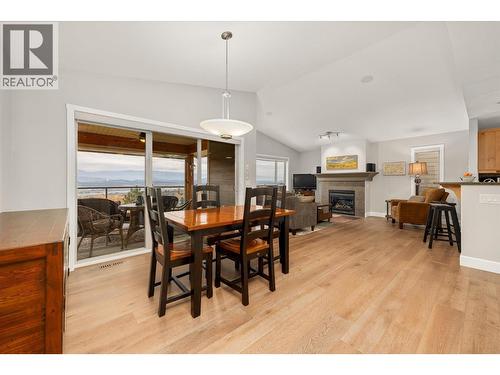 5342 Trickle Creek Drive, Kelowna, BC - Indoor Photo Showing Dining Room With Fireplace
