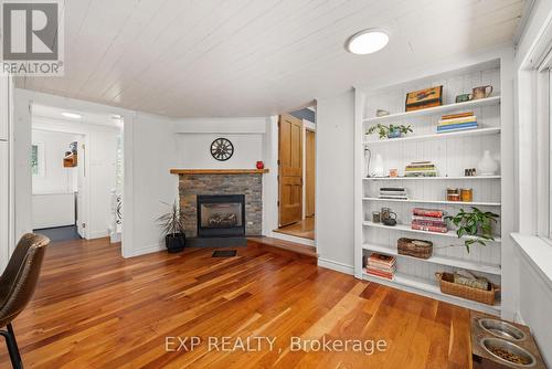 Kitchen propane fireplace - 141 & 142 Station Road, Prince Edward County (Hillier Ward), ON - Indoor Photo Showing Living Room With Fireplace