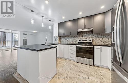 309 - 8 Silver Bell Grove, Toronto, ON - Indoor Photo Showing Kitchen With Upgraded Kitchen