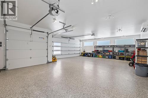 Triple Heated and Cooled Garage - 7141 Dunwaters Road, Kelowna, BC - Indoor Photo Showing Garage