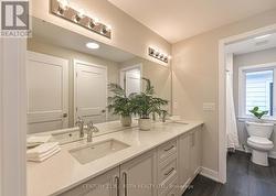 Second full bathroom with  dual vanities - 