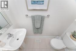 Bathroom with baseboards and tile patterned flooring - 