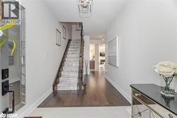 Staircase with baseboards and wood finished floors - 