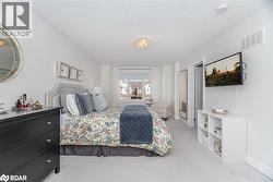 Bedroom with carpet floors and a textured ceiling - 