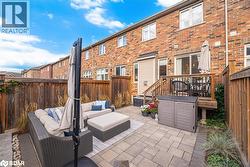 Fenced backyard with a patio and an outdoor living space - 