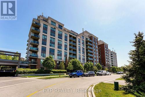 723 - 120 Dallimore Circle, Toronto, ON - Outdoor With Balcony With Facade