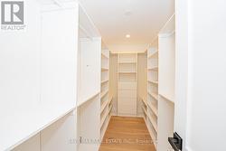 Primary Bedroom Walk-In Custom Closet - 