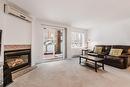 Salon - 101-2815 Boul. René-Laennec, Laval (Vimont), QC  - Indoor Photo Showing Living Room With Fireplace 