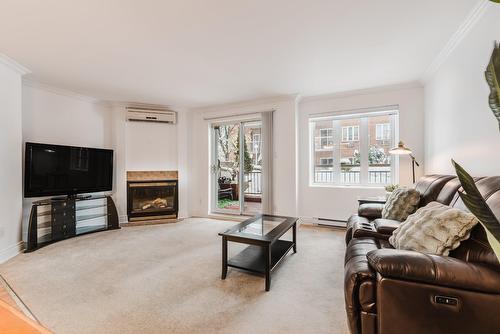 Salon - 101-2815 Boul. René-Laennec, Laval (Vimont), QC - Indoor Photo Showing Living Room With Fireplace